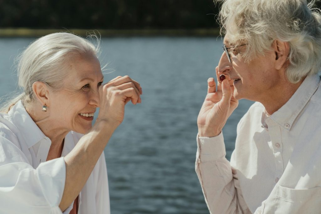 Two senior friends smiling and enjoying time together